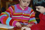 children working at our Montessori school, which is now in Spokane